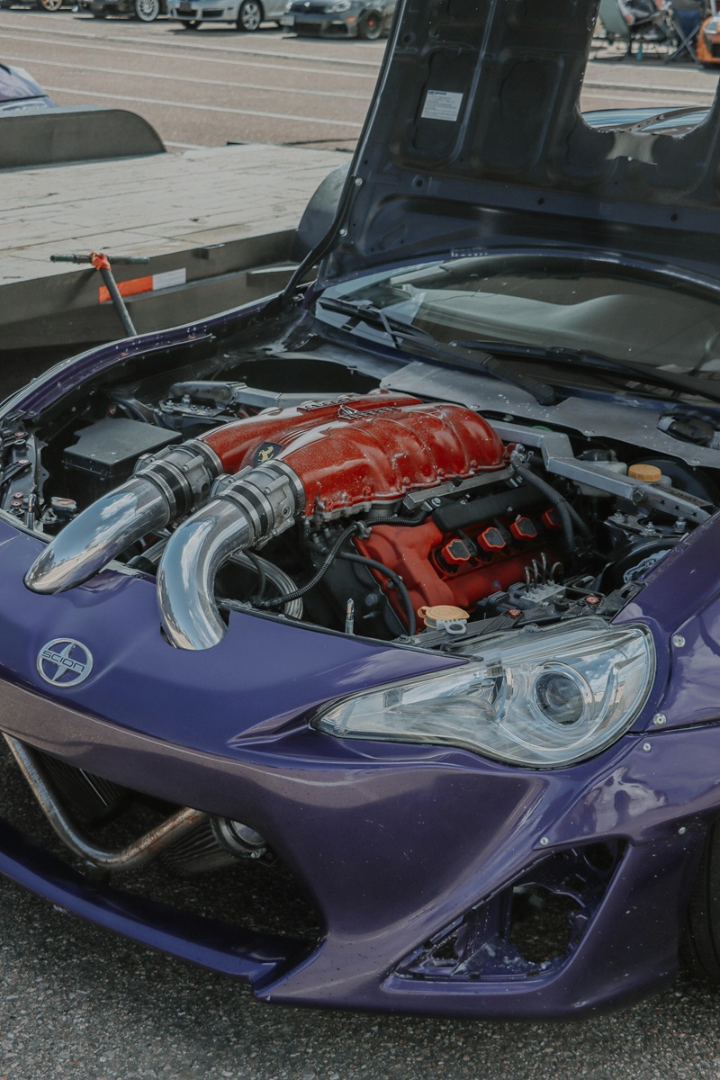 Technician adjusting engine control unit for performance tuning